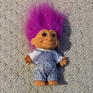 Troll doll in overalls